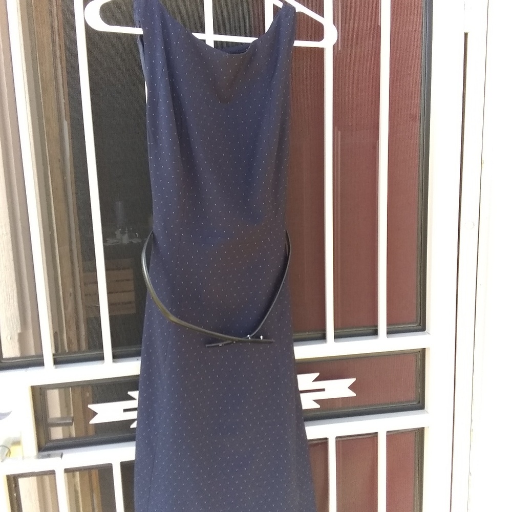 Dark blue polka dot sleeveless dress.
